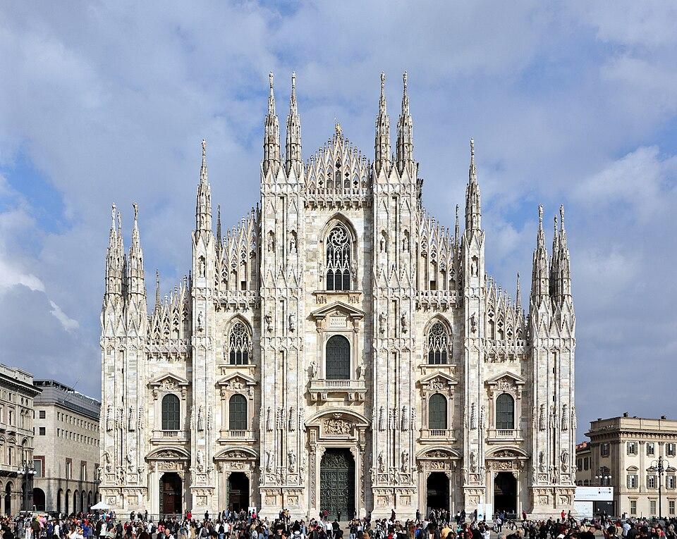 The marble facade and spires of Milan's Duomo.